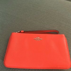 Coach clutch with wrist strap. NWOT